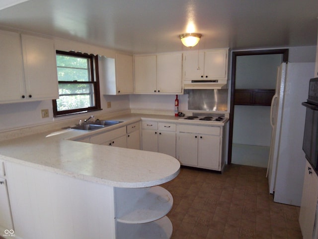 kitchen featuring under cabinet range hood, a peninsula, a sink, white cabinetry, and light countertops