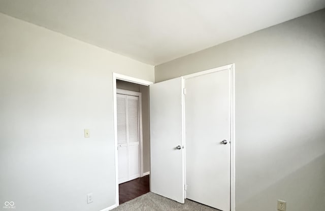 unfurnished bedroom with carpet flooring