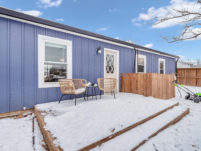 exterior space featuring fence and board and batten siding