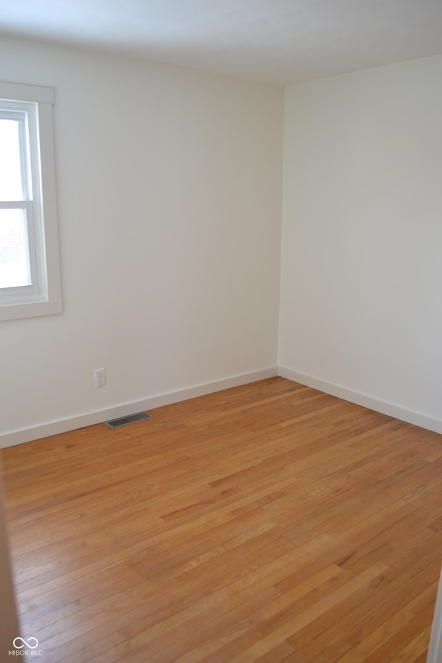 unfurnished room with light hardwood / wood-style flooring