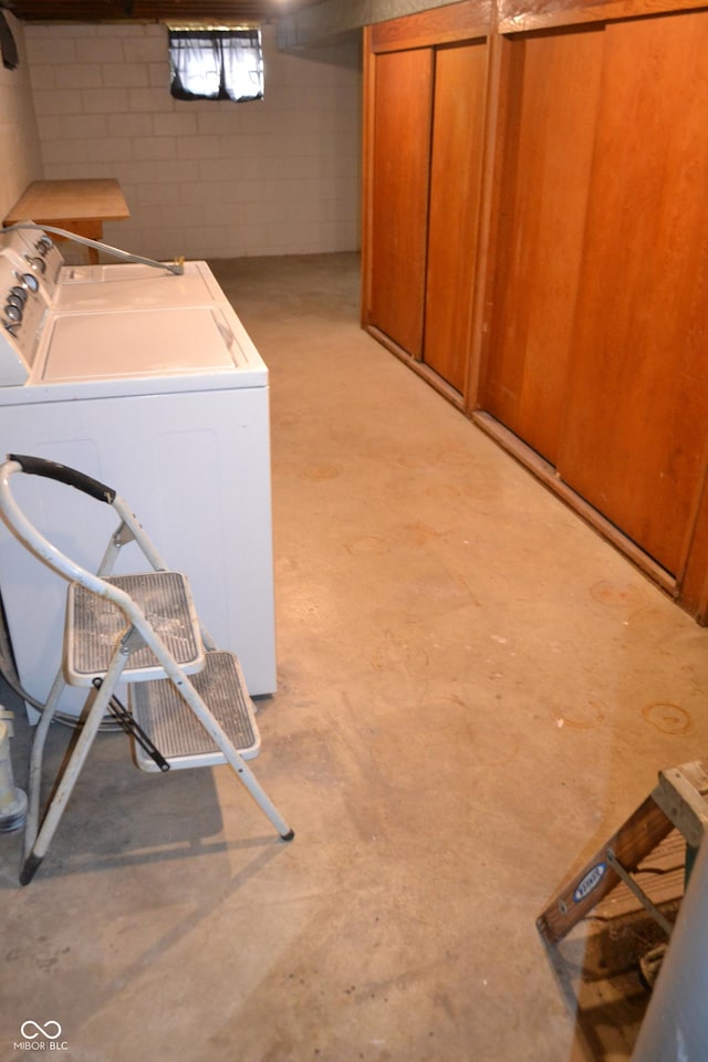 basement with washing machine and clothes dryer