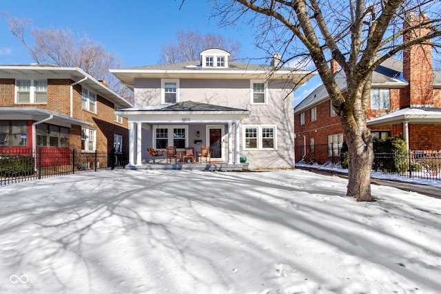 view of front of home featuring fence and stucco siding