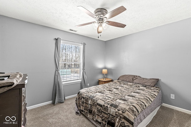 bedroom featuring carpet flooring, visible vents, and baseboards