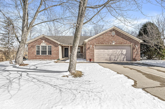 ranch-style home with a garage, brick siding, and driveway