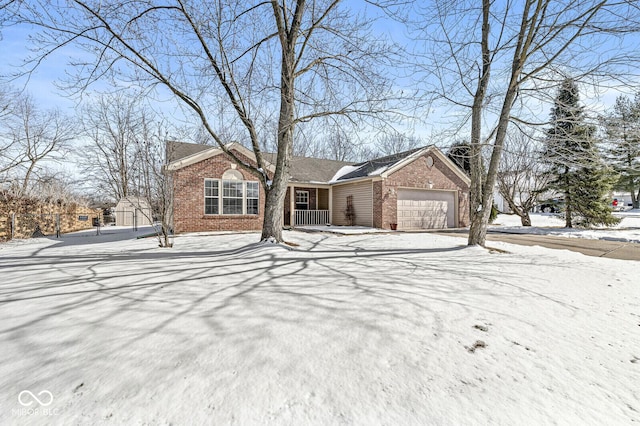 single story home with a garage and brick siding