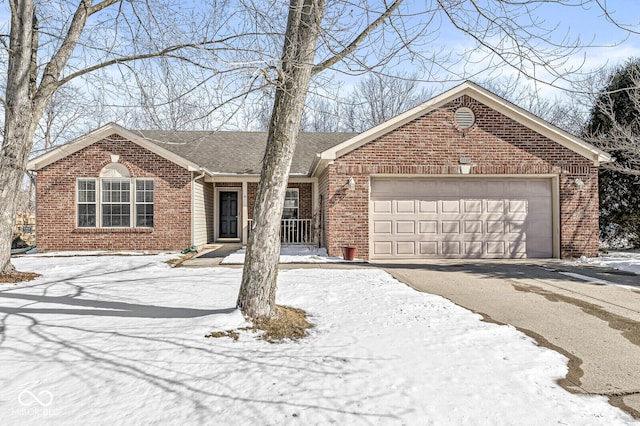 ranch-style house featuring brick siding, driveway, an attached garage, and roof with shingles