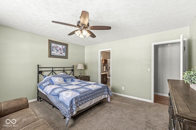 bedroom featuring a ceiling fan, baseboards, a textured ceiling, and carpet flooring