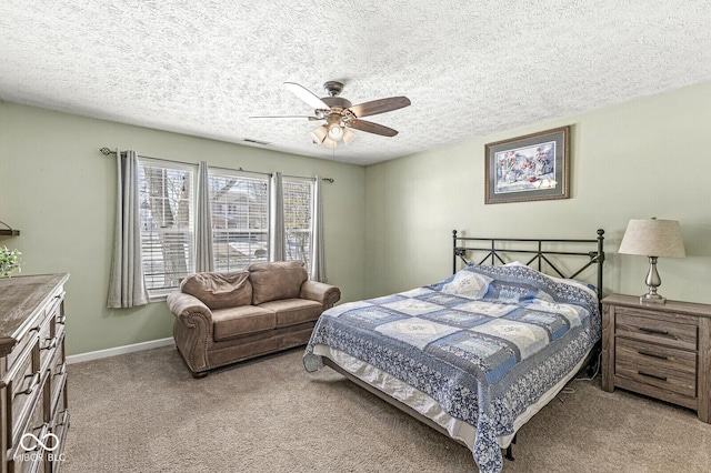 bedroom featuring visible vents, a ceiling fan, light carpet, a textured ceiling, and baseboards