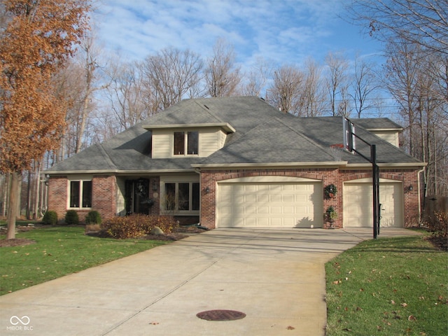 view of front facade featuring a front yard and a garage