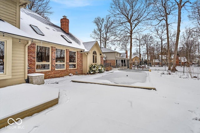 view of yard layered in snow