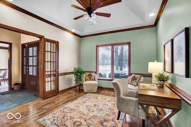 office space with ceiling fan, crown molding, and hardwood / wood-style floors