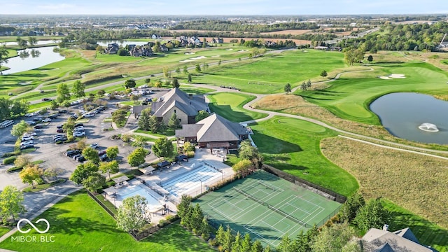 bird's eye view featuring view of golf course and a water view