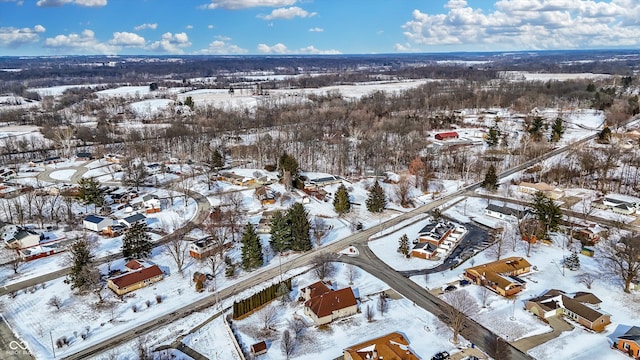 snowy aerial view with a residential view