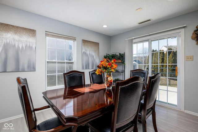 dining space featuring recessed lighting, wood finished floors, visible vents, and baseboards