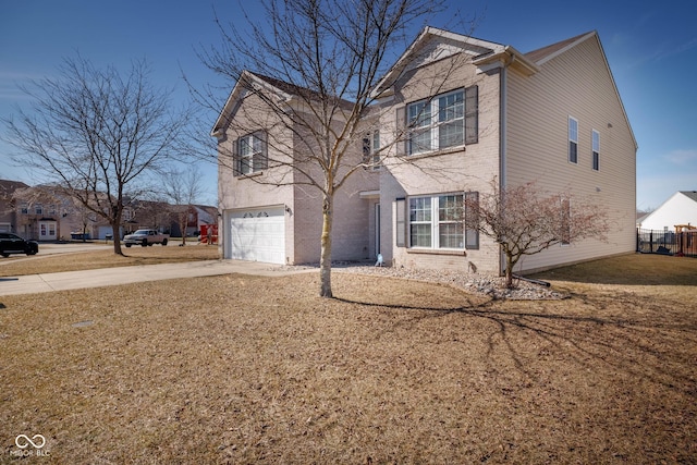 traditional home featuring driveway, a garage, a front lawn, and brick siding