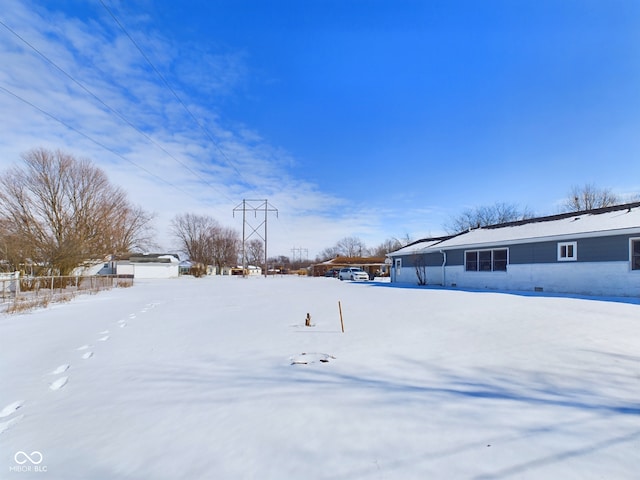 view of yard layered in snow