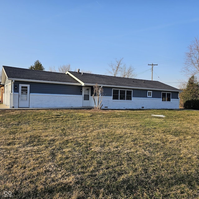 ranch-style home with brick siding and a front lawn