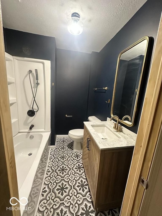 full bath with shower / bathing tub combination, toilet, vanity, a textured ceiling, and tile patterned flooring