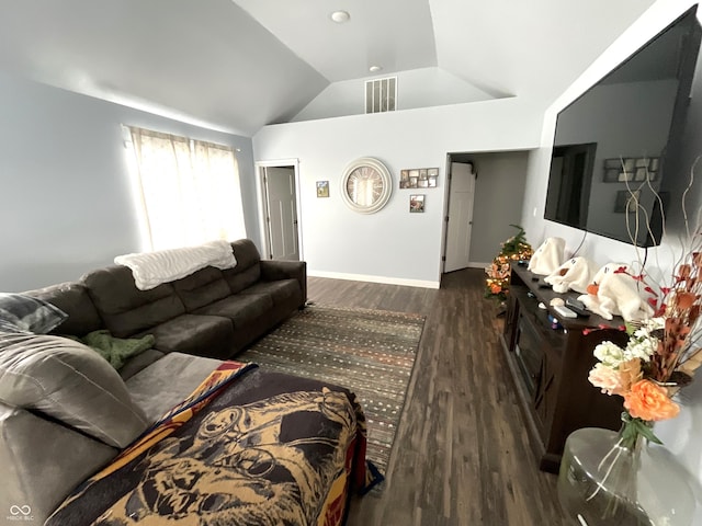 living area with vaulted ceiling, visible vents, baseboards, and wood finished floors