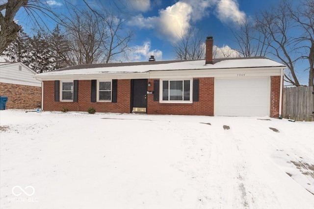 ranch-style home featuring brick siding, a chimney, and an attached garage