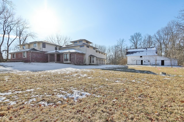 exterior space featuring brick siding