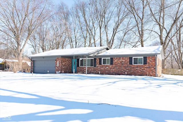 single story home with brick siding and an attached garage