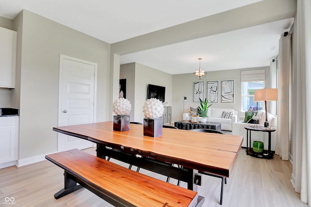 2134 Boxwood Dr, Greenfield, IN 46140 - dining space with a chandelier, light wood-style flooring, and baseboards