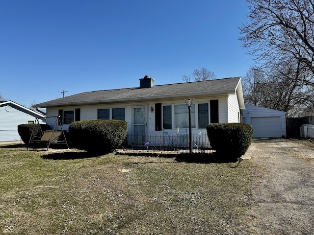 view of front of property with a chimney, an outdoor structure, and fence