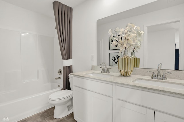 bathroom with shower / bath combo, a sink, toilet, and double vanity