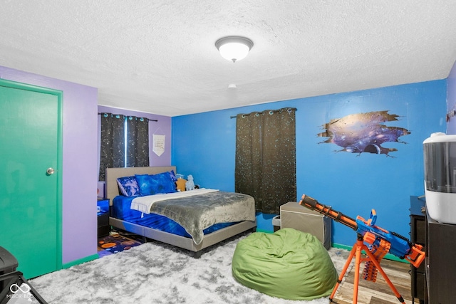 bedroom featuring a textured ceiling