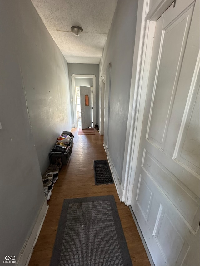 1808 E Washington St, Indianapolis, IN 46201 - hallway featuring a textured ceiling, visible vents, and dark wood-type flooring