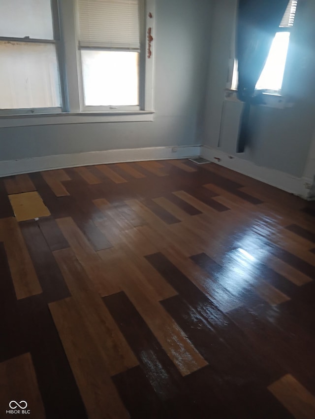 1808 E Washington St, Indianapolis, IN 46201 - spare room featuring wood finished floors and a healthy amount of sunlight
