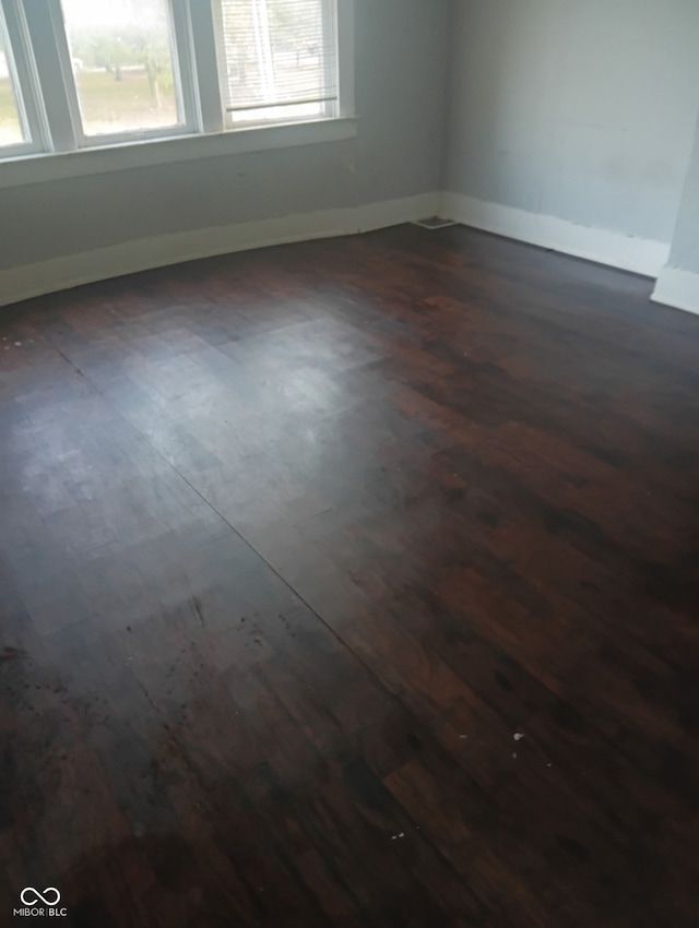 1808 E Washington St, Indianapolis, IN 46201 - spare room with dark wood-style floors and baseboards