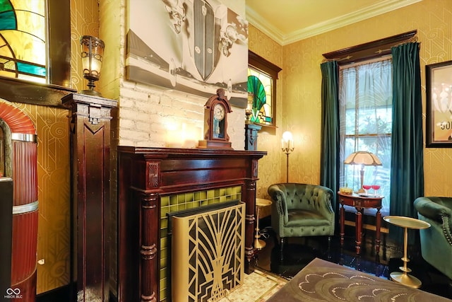 sitting room with ornamental molding and a fireplace