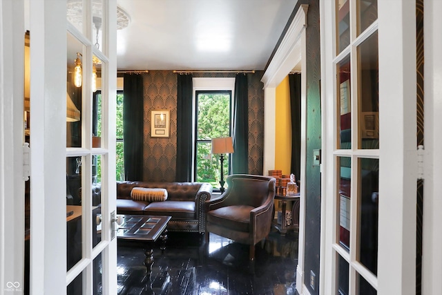 sitting room featuring wallpapered walls