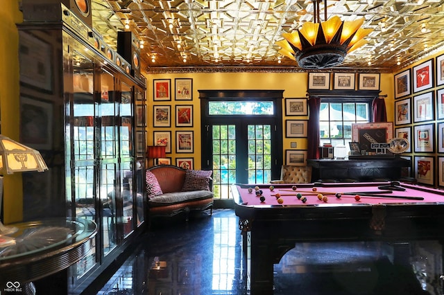 recreation room with an ornate ceiling, french doors, ornamental molding, and billiards