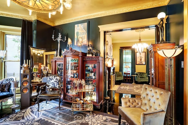 miscellaneous room featuring crown molding and a notable chandelier