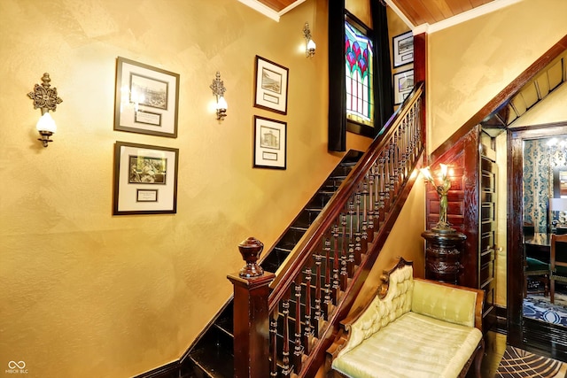 staircase featuring crown molding