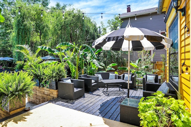 wooden terrace with an outdoor hangout area