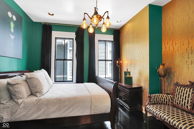 bedroom with a chandelier and recessed lighting