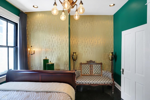 bedroom featuring an inviting chandelier and recessed lighting