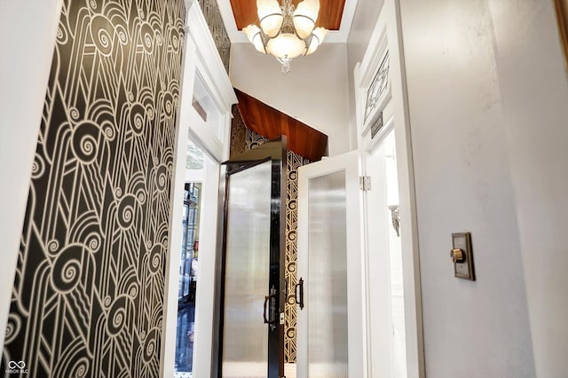 bathroom with a chandelier