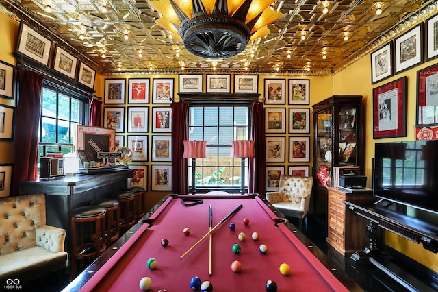 recreation room featuring pool table, ornamental molding, and an ornate ceiling