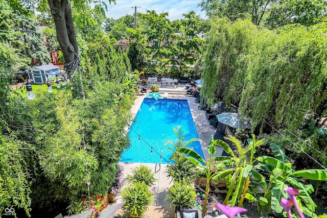 outdoor pool featuring a patio area