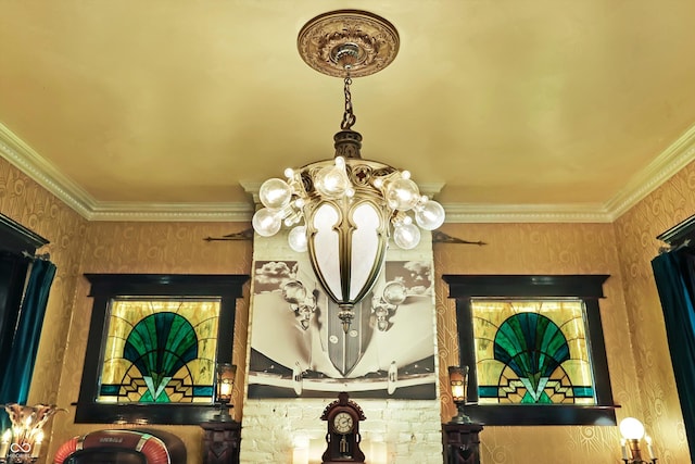 interior details featuring crown molding and wallpapered walls