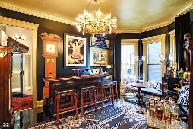 bar featuring a bar and a chandelier