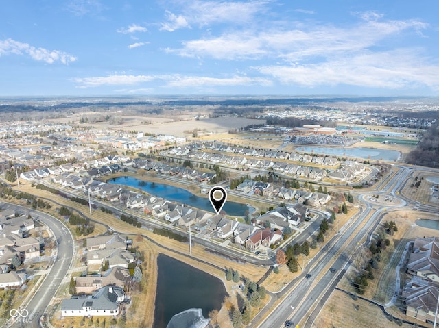 bird's eye view with a residential view and a water view