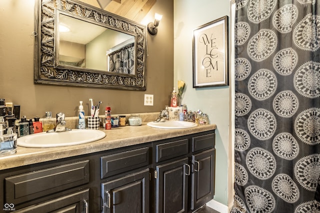 full bath featuring double vanity and a sink