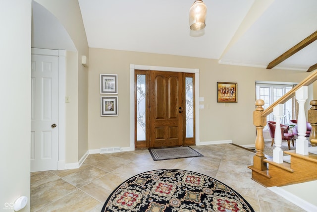 entryway featuring visible vents, vaulted ceiling, stairway, and baseboards