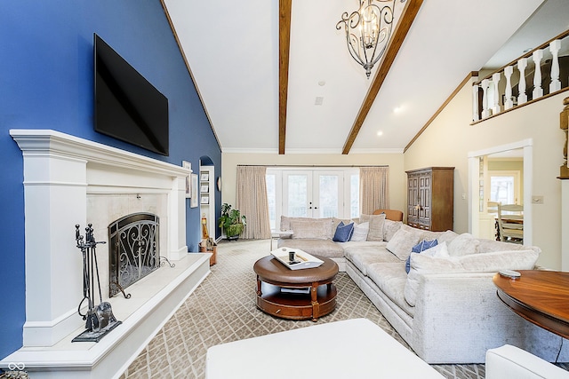 carpeted living room featuring a fireplace with raised hearth, high vaulted ceiling, french doors, and beamed ceiling